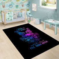 Black area rug with purple-blue skull wings, roses, and blue script lettering