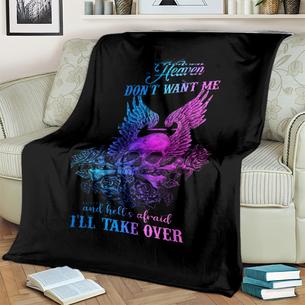 Black skull blanket on couch with blue and purple wings, roses, and 'I'll take over'