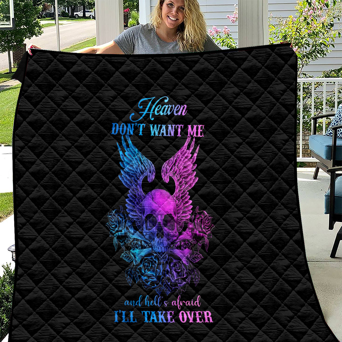 Black quilt blanket with diamond quilting and purple/blue winged skull graphic, Heaven text