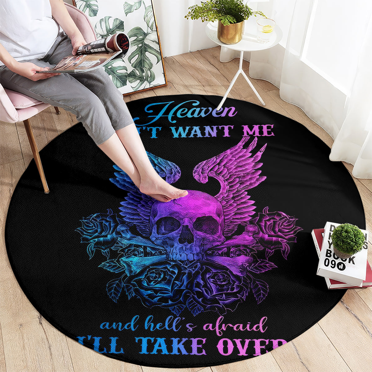 Black round rug with purple and blue winged skull graphic and quote text, Heaven