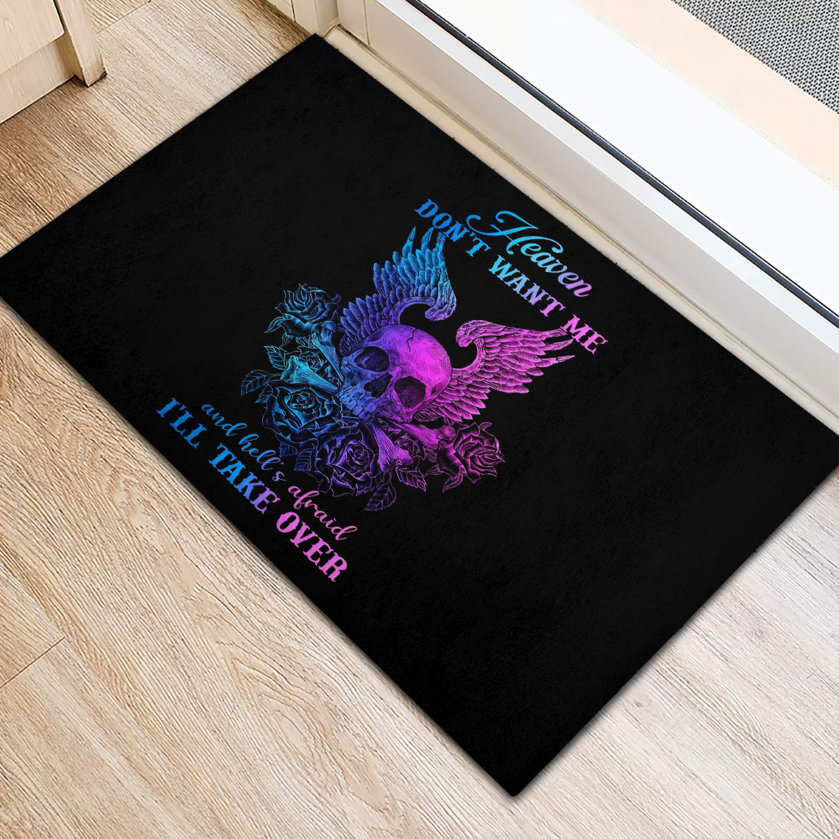 Black rubber doormat with purple skull-wing graphic and blue text accents