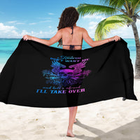 Black skull-wing sarong with purple graphic and blue text, held open across shoulders