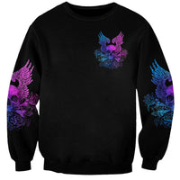 Black unisex sweatshirt with purple and blue wings-and-skull logo on front