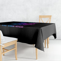 Black tablecloth with neon blue and purple skull wing graphic and bold text across