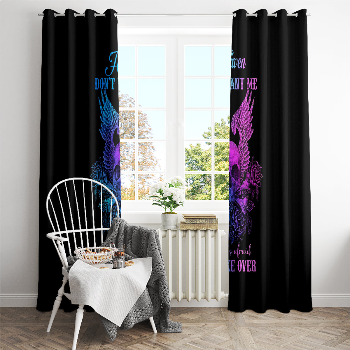 Black curtain panels with blue and purple winged skull graphic and visible rod top