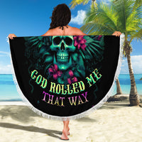 Round black beach blanket with teal skull graphic and tropical flower text, fringed edge.
