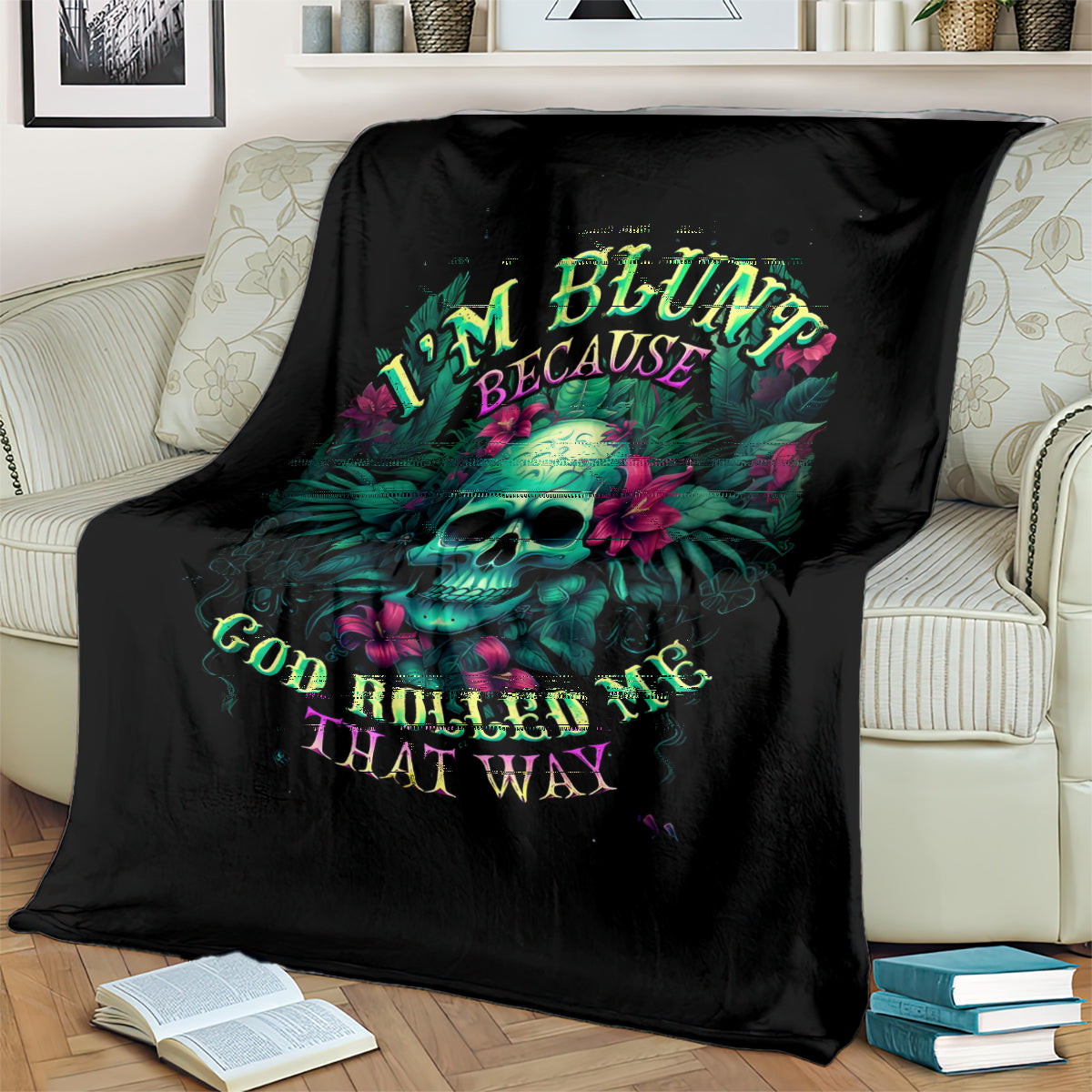 Black skull graphic blanket with neon-style lettering, spread over a couch