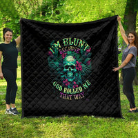 Black quilt blanket with diamond quilting and colorful skull graphic with text