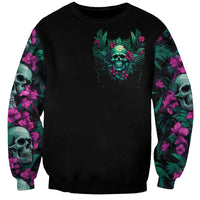Black unisex sweatshirt with small neon skull and tropical foliage graphic