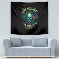 Black tapestry with teal skull graphic, pink accents, and curved multicolor text