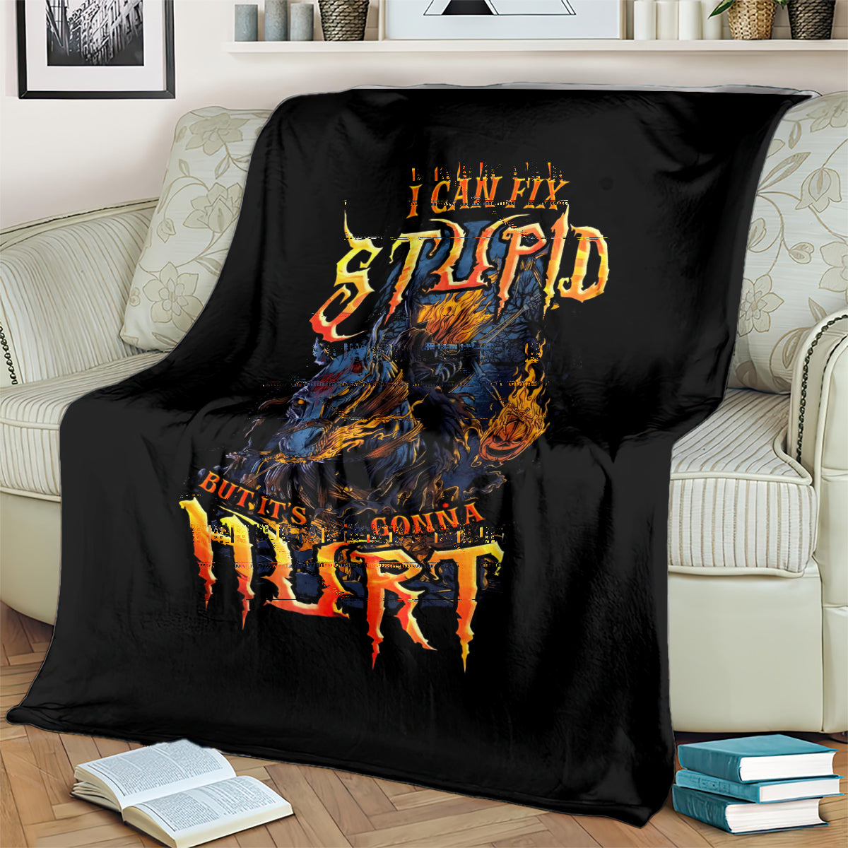 Black throw blanket with fiery skull artwork and distressed quote text