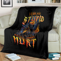 Black throw blanket with fiery skull artwork and distressed quote text
