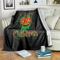 Black Halloween blanket draped over couch with jack-o’-lantern skull and glowing text