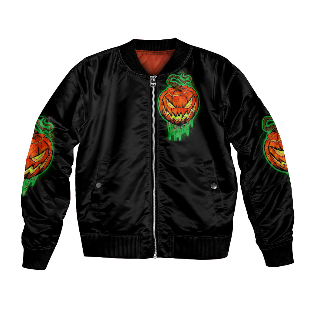 Black bomber jacket with front zipper and green/orange jack-o-lantern skull emblem