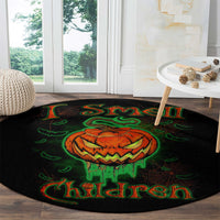 Round black Halloween rug with jack-o’-lantern skull graphic, green web and 'Children' text
