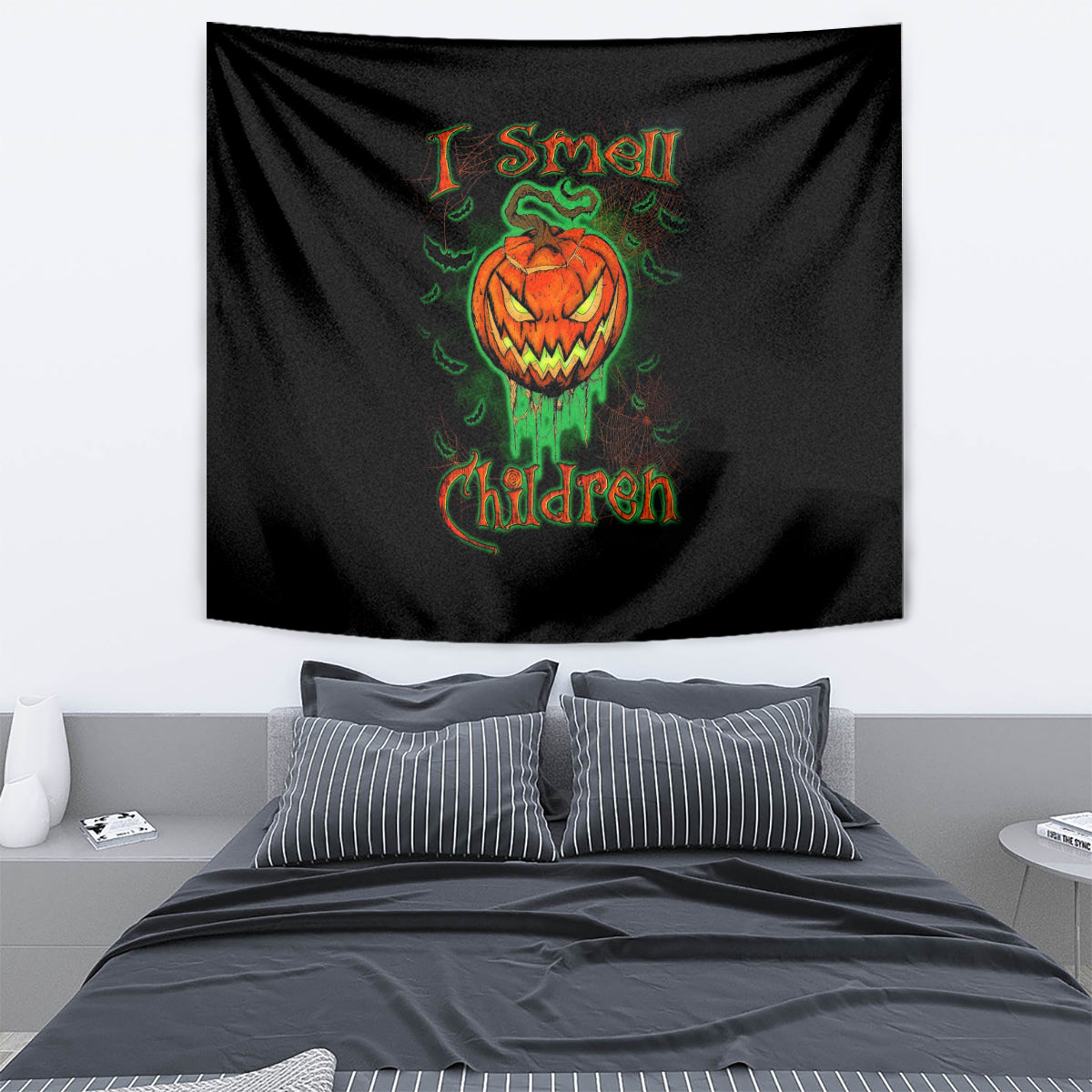 Black jack-o’-lantern skull tapestry with green snake and “I Smell Children” text