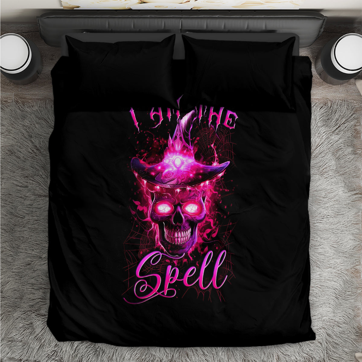Black bedding set with witch skull graphic, pink glow, and two matching pillowcases