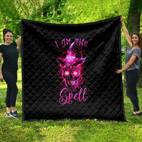 Black quilt with quilted diamond pattern and neon pink witch skull graphic.