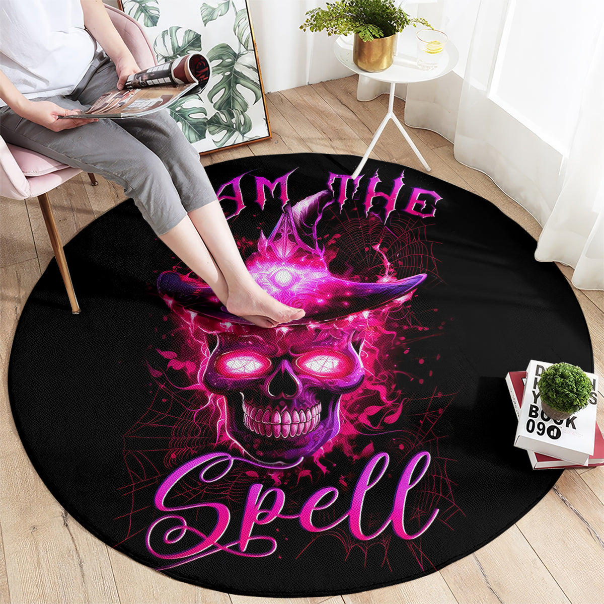 Round black area rug with purple skull graphic and stylized "Spell" text