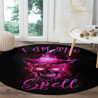 Round black area rug with purple skull and "Spell" design across the center