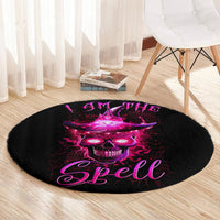Round black area rug with centered purple skull art and "Spell" text