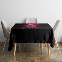 Black tablecloth on square table with purple witch skull graphic centered