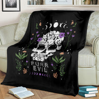 Black cat skull blanket draped on sofa with cats, flowers, moons, and 'PURR EVIL' design
