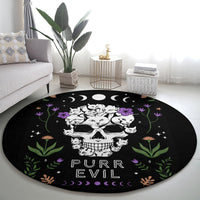 Black round cat skull rug with PURR EVIL lettering and crescent moon accents