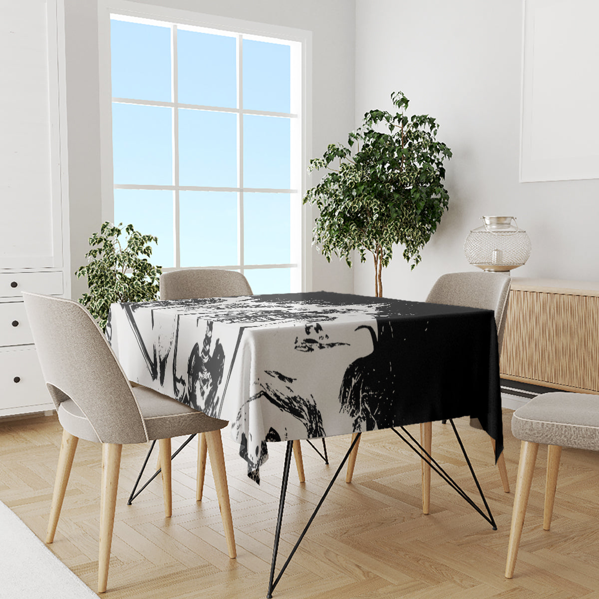 White tablecloth on dining table, black-and-gray skull graphic with high-contrast panels.