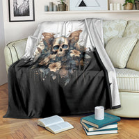 Gothic butterfly skull blanket folded over sofa, white top and black draped section