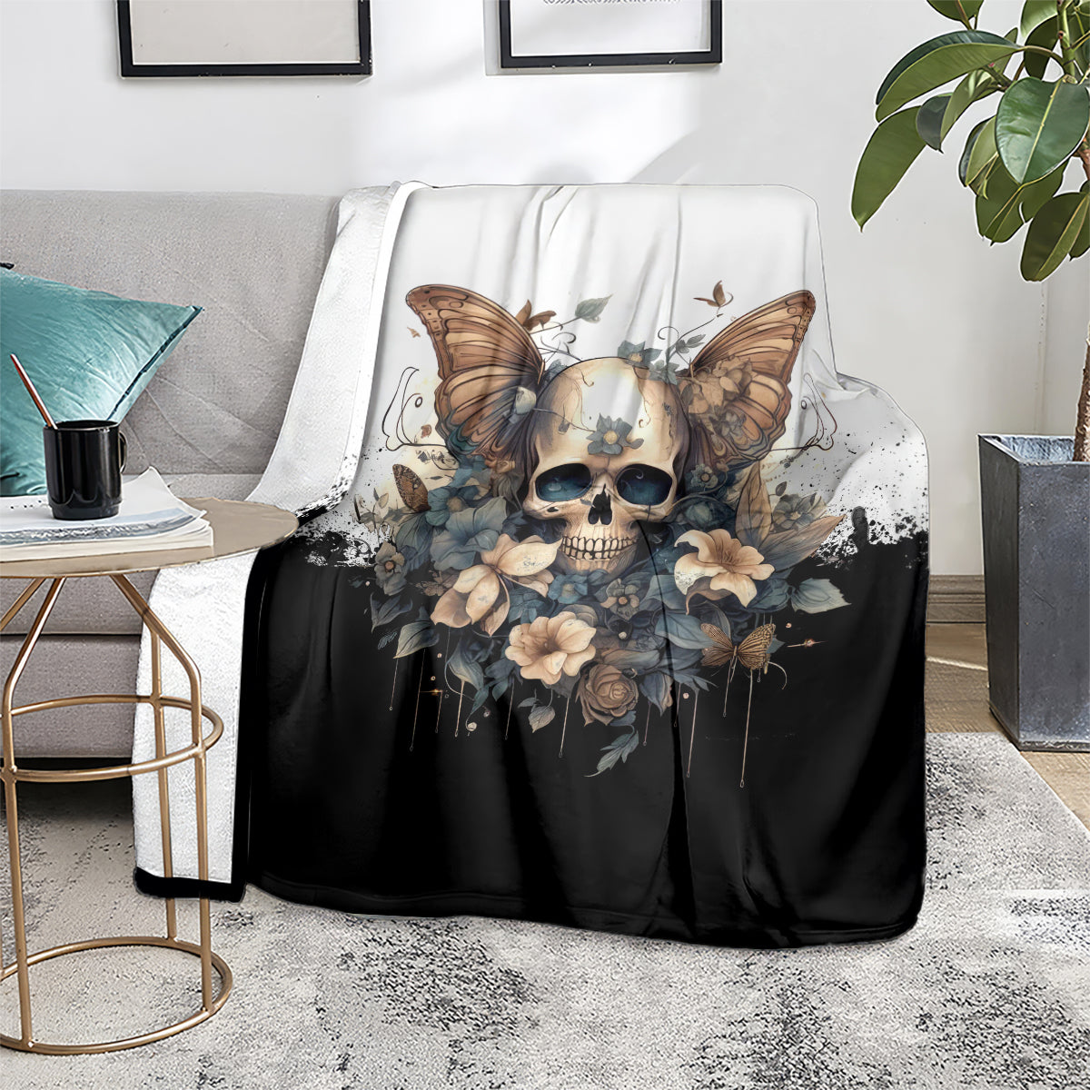 Gothic skull butterfly blanket on gray sofa, black body with cream floral accents