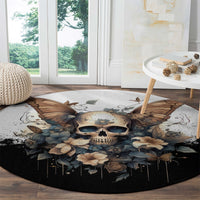 Black round rug close-up with skull face, butterflies, flowers, and drip accents