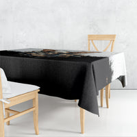Black gothic skull-and-butterfly tablecloth with floral design, draped over table