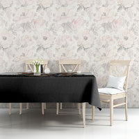 Black tablecloth with butterfly skull motif and floral accents, draped over table
