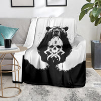Black and white Viking bear skull throw blanket on sofa with striking bear skull print