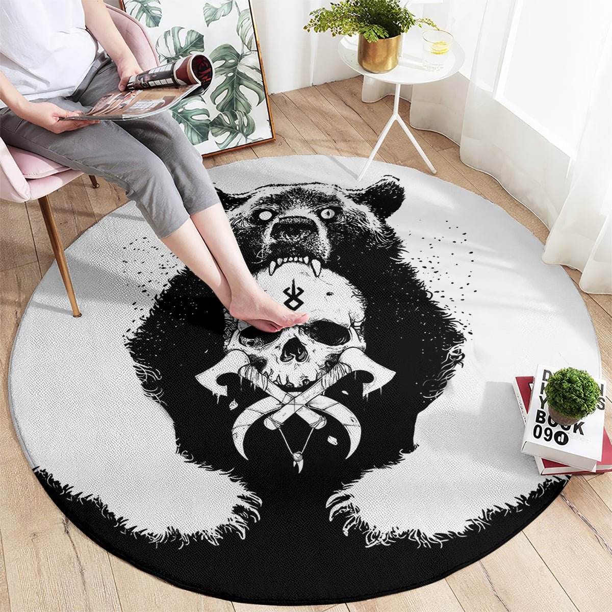 Round black-and-white graphic area rug with roaring bear, skull, and Viking-style border