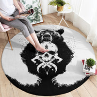 Round black-and-white graphic area rug with roaring bear, skull, and Viking-style border