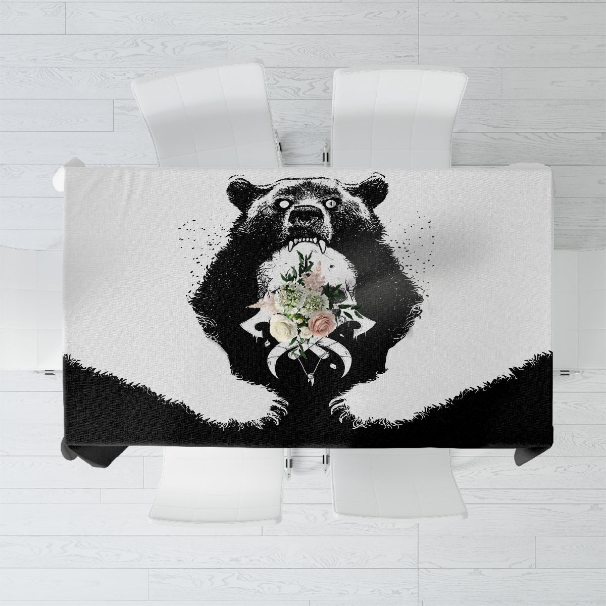 Black tablecloth featuring centered bear head graphic with floral details