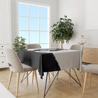 Black tablecloth with bear head print on dining table and chairs