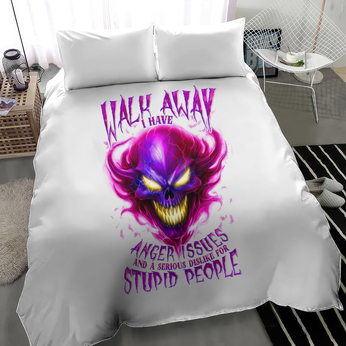 White duvet cover with purple flame skull face and 'stupid people' slogan, two pillows