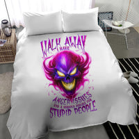 White duvet cover with purple flame skull face and 'stupid people' slogan, two pillows