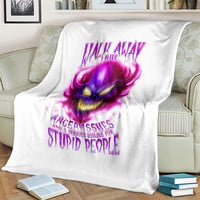 White throw blanket with large purple flame skull graphic and slogan text
