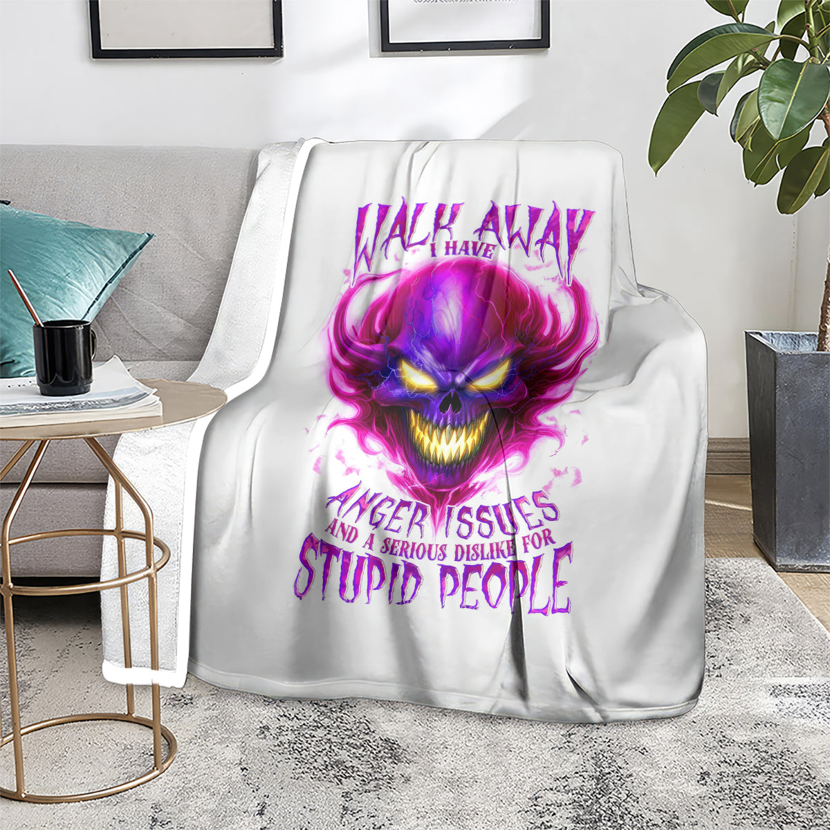 White throw blanket with purple flame skull graphic and slogan text, smooth front