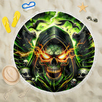 Round beach blanket with green skull face graphic and fringed white edge