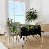 Black skull tablecloth with neon green skull artwork across dining table, wide view