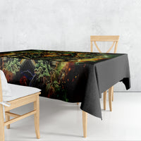 Black tablecloth draped on dining table, green skull and fiery rose artwork