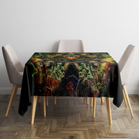 Black tablecloth with green skull and rose motif over square table