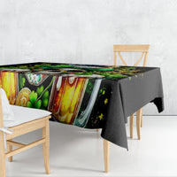 Black tablecloth with colorful Irish-themed beer mug and clover print on table