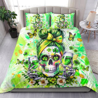 Green bedding set featuring central skull with shamrocks, butterflies, and wine glasses on duvet.