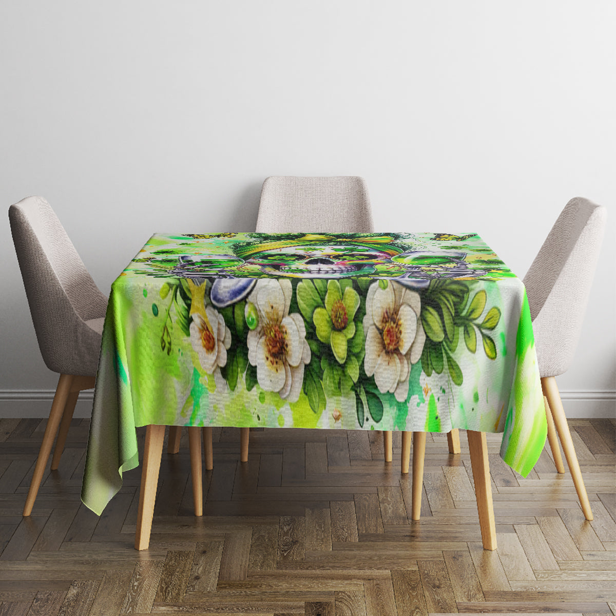 Green tablecloth with large flower print and leafy pattern, laid on dining table